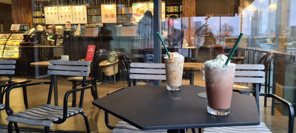 Ice coffees on the warm Wingo table at Starbucks - Warsaw.